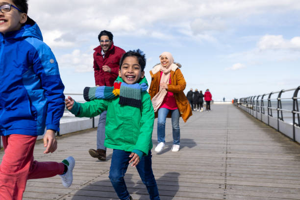 Happy Young Boy Outdoors with his Family