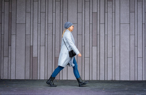 istock Mature woman walking in city 2177451359
