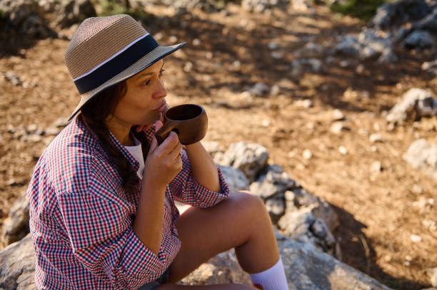 istock Woman Enjoying Coffee Outdoors 2177451620