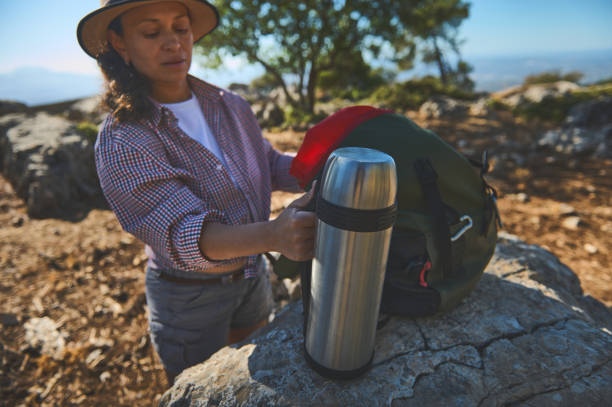 istock Woman enjoying a refreshing break on a serene mountain hike 2177451651