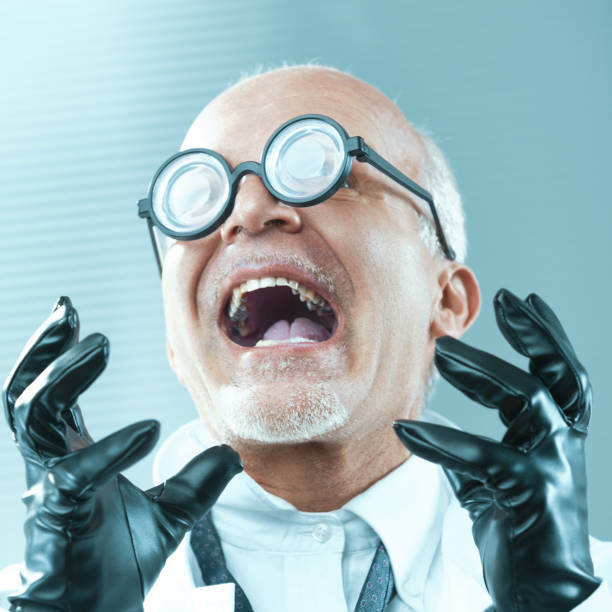 Scientist wearing thick glasses and black gloves is screaming with a shocked expression. He is making a funny face while looking up