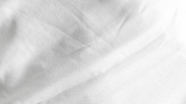 istock Smooth white silk bedsheets, soft and luxurious fabric, elegant blanket background 2177453296