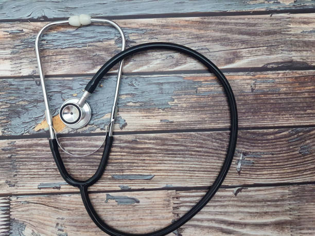 istock Stethoscope  on a wooden table, top view 2177454476