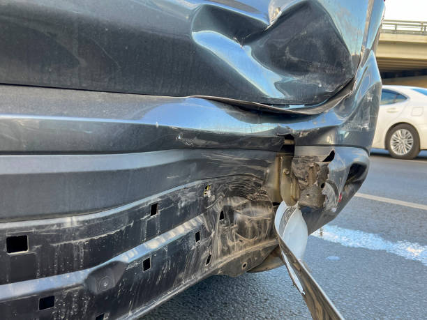 istock Damaged car bumper after car accident close up 2177454741