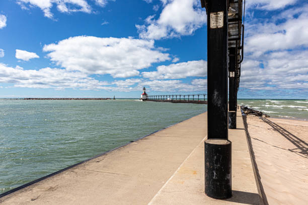 Michigan City Lighthouse on Lake Michigan on a summer day with blue sky in Michigan City, Indiana USA