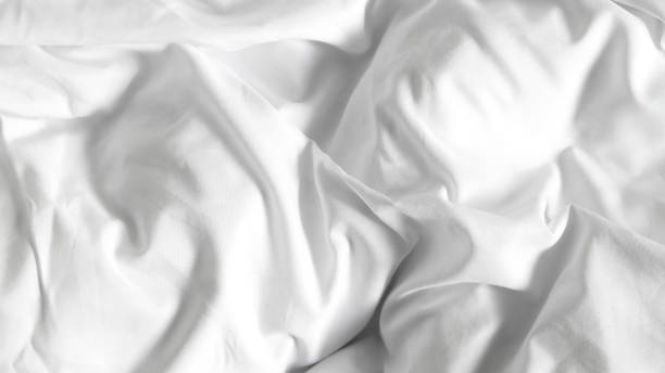 istock Smooth white silk bedsheets, soft and luxurious fabric, elegant blanket background 2177456603