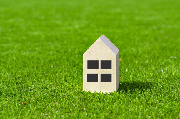 istock Model house on a lawn. Housing concept. 2177456668