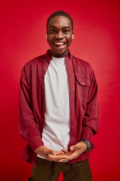 istock young african american man rejoices with hands to camera, isolated on red background studio portrait 2177457422