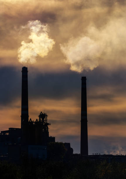 Pollution rising from factory smoke smokestack chimney environment