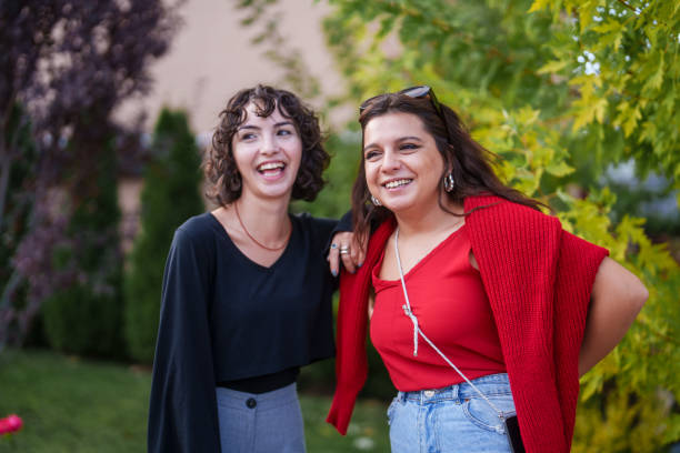 istock Two female colleagues standing in front of a greenery. 2177459821