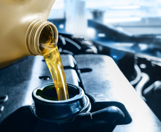 istock Pouring motor oil into the car engine 2177460656