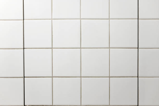 istock White square tiles on bathroom wall as texture or background 2177460698