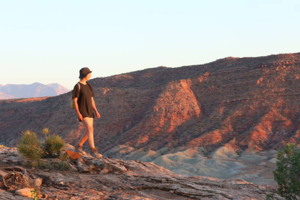 istock Young woman explores canyon lands 2177460785