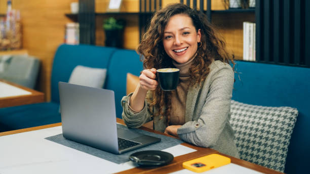 istock Businesswoman in cafe working on laptop 2177462765