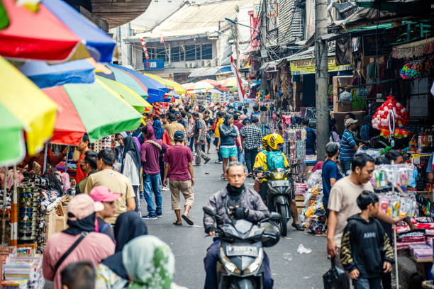 Bustling Street Market Scene in Jakarta, Indonesia stock photo