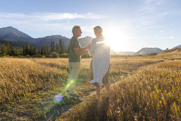 istock Mature couple explore mountain meadow at sunset 2177466669