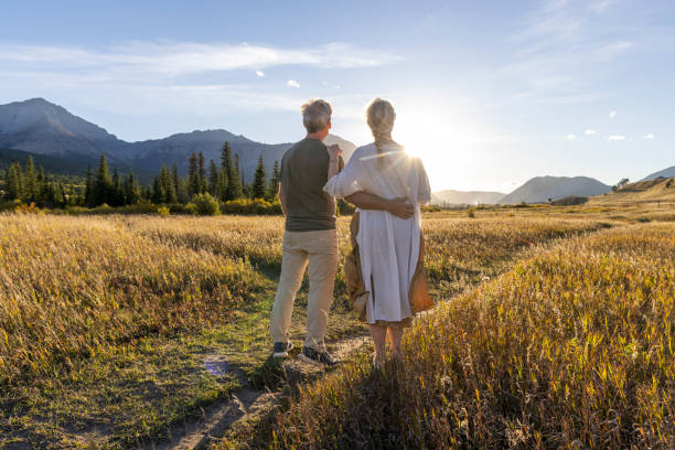 istock Mature couple explore mountain meadow at sunset 2177466729