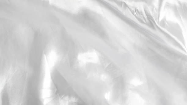 istock Smooth white silk bedsheets, soft and luxurious fabric, elegant blanket background 2177466821