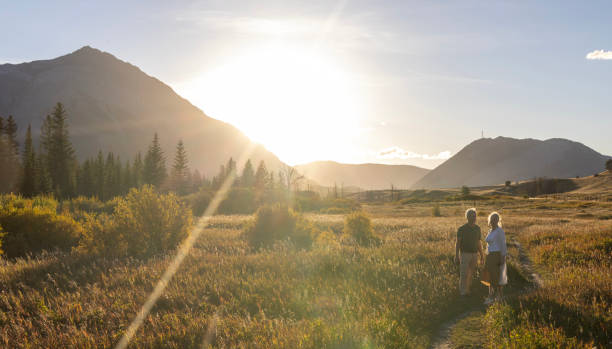 istock Mature couple explore mountain meadow at sunset 2177466903