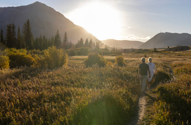 istock Mature couple explore mountain meadow at sunset 2177467021