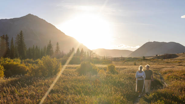 istock Mature couple explore mountain meadow at sunset 2177467023