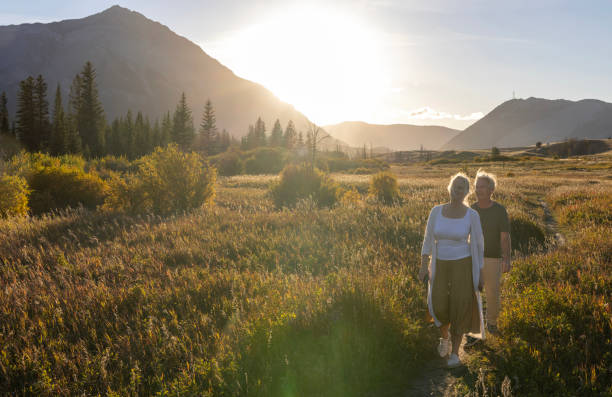 istock Mature couple explore mountain meadow at sunset 2177467078