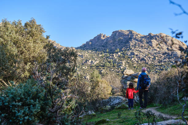 istock A Mother and son treking together admiring mountain scenery. 2177471990