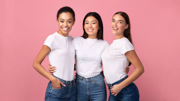 istock Three Women Embracing Standing In Studio On Pink Background, Panorama 2177474470