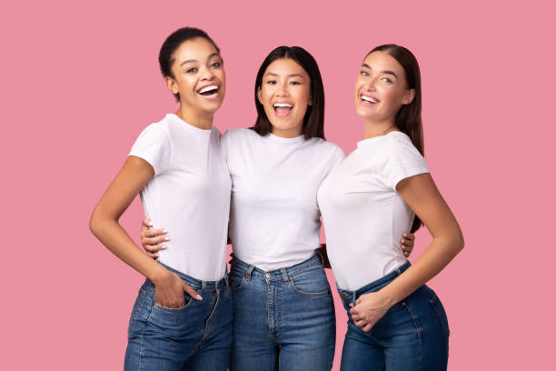 istock Three Millennial Girls Embracing Standing On Pink Background, Studio Shot 2177474474