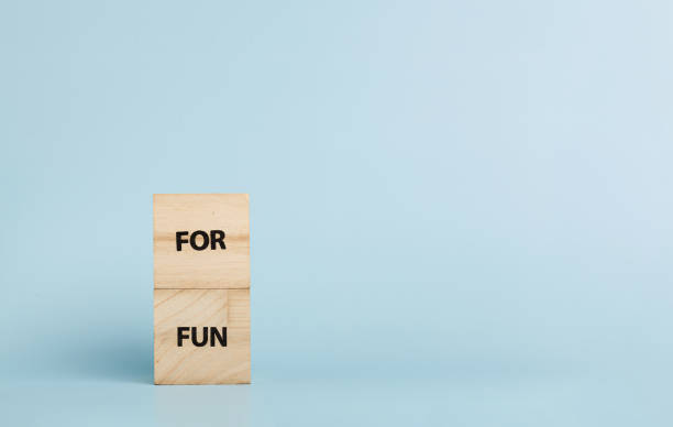 istock Wooden cubes with inscriptions For Fun on a blue background 2177476479