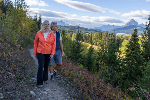 istock Mature couple hike on mountain pathway in autumn 2177477942