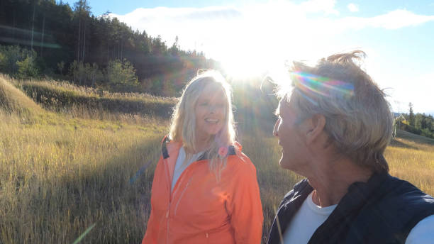 istock Mature couple hike on mountain pathway in autumn 2177478527
