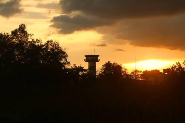 Airport monitoring tower in Palangka Raya City, Central Kalimantan Province, Indonesia. Photographed from a distance in the evening.