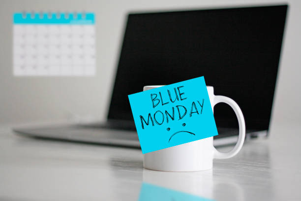 istock Blue Monday text with sad face on the cup. Blue Monday concept 2177479370