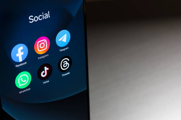October 8, 2024, Brazil. In this photo illustration, the Facebook, Instagram, WhatsApp, TikTok and Threads apps logo is displayed on a smartphone screen