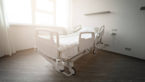 istock An empty hospital bed in a clean, modern room with soft sunlight coming through the window. The scene conveys a peaceful and sterile environment, ready for patient care and recovery. 2177481365