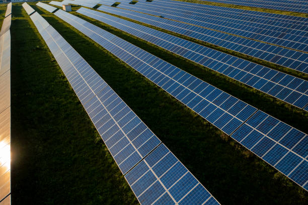 istock Drone view of blue solar panels on agricultural landscape 2177482429