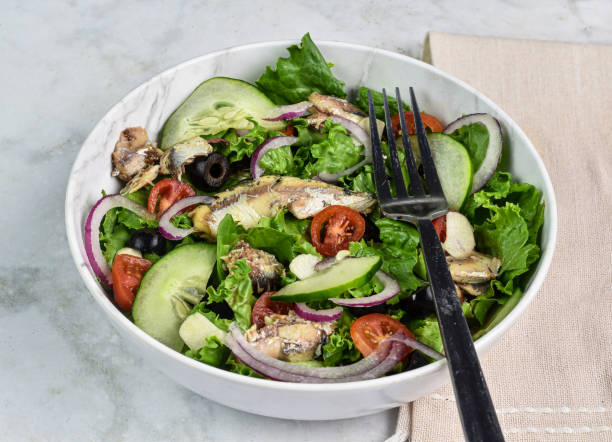 istock garden salad  with sardines on top 2177484258