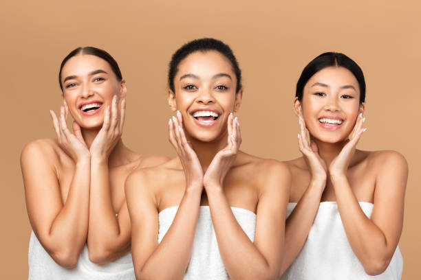 istock Three Girls Touching Face With Smooth Skin On Beige Background 2177484311