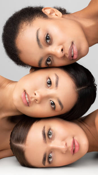 istock Portrait Of Three Models Girls Posing Over Gray Studio Background 2177484317