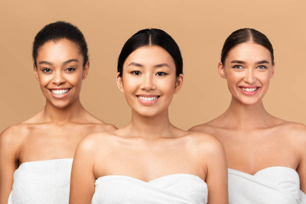 istock Three Diverse Ladies Models Posing In Bath Towels, Beige Background 2177484335