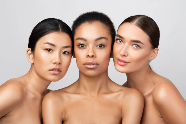 istock Three Pretty Girls Posing Shirtless On Gray Studio Background 2177484660