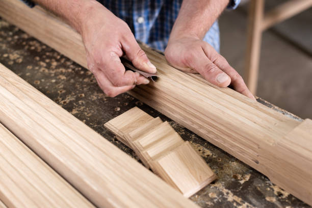 istock The carpenter sanded small oak parts with sandpaper 2177485676