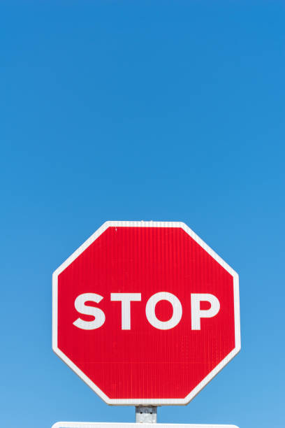 istock isolated stop signal on a blue-sky summer day 2177488822