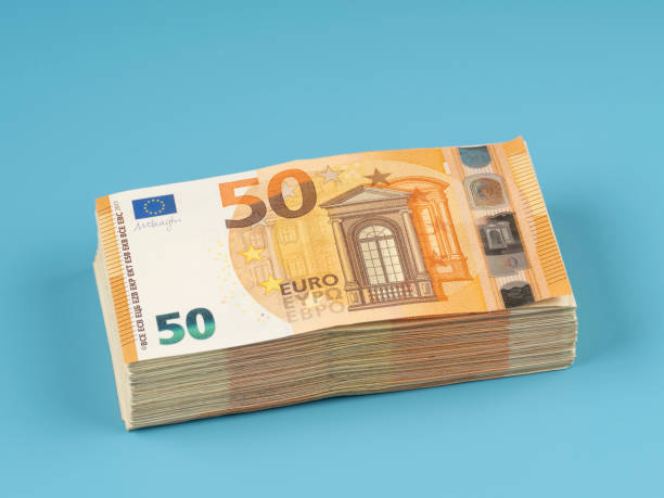 istock 50 Euro banknotes on a blue background 2177489599