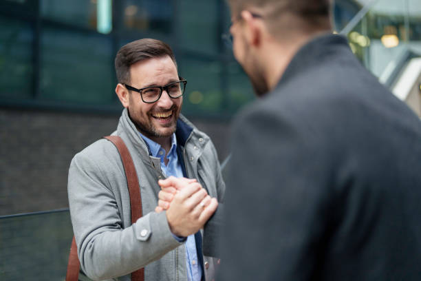 istock Outdoor Handshake Between Smiling Business Executives 2177490015