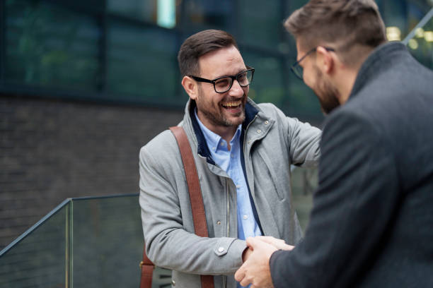 istock Business Handshake Between Smiling Caucasian Men Outdoors 2177490018