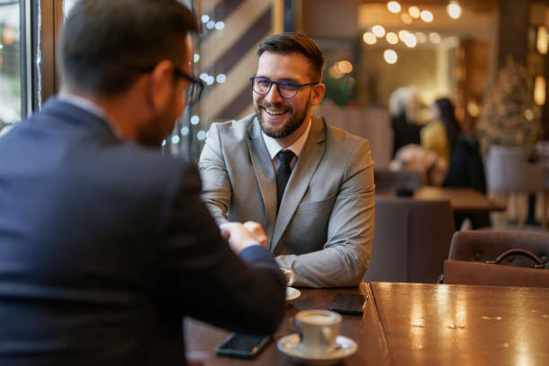 istock Professional Handshake Between Businessmen in Cafe 2177490083