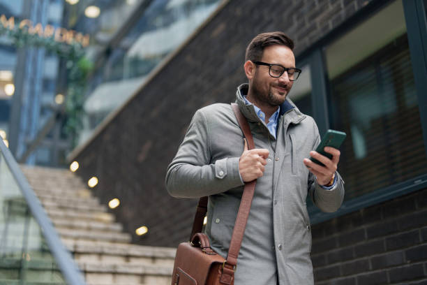 istock Business Professional Engages with Technology on the Go 2177490649