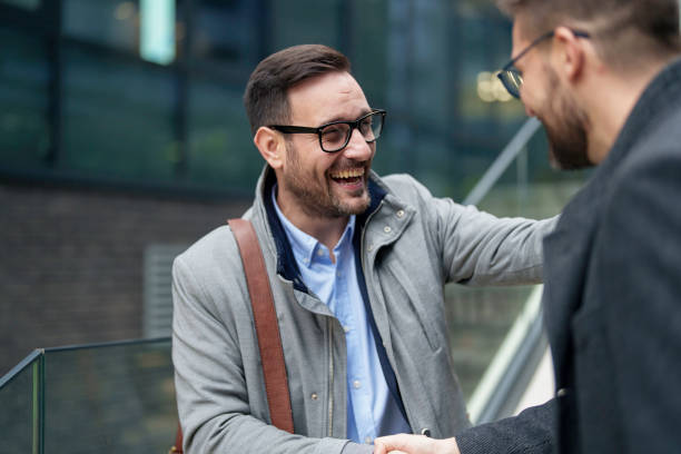 istock Professional Handshake Between Smiling Businessmen Outdoors 2177490668